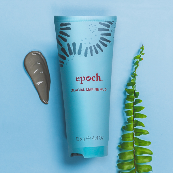 Tube of Epoch Glacial Marine Mud lying next to a smudge of Glacial Marine Mud and fern leaf.